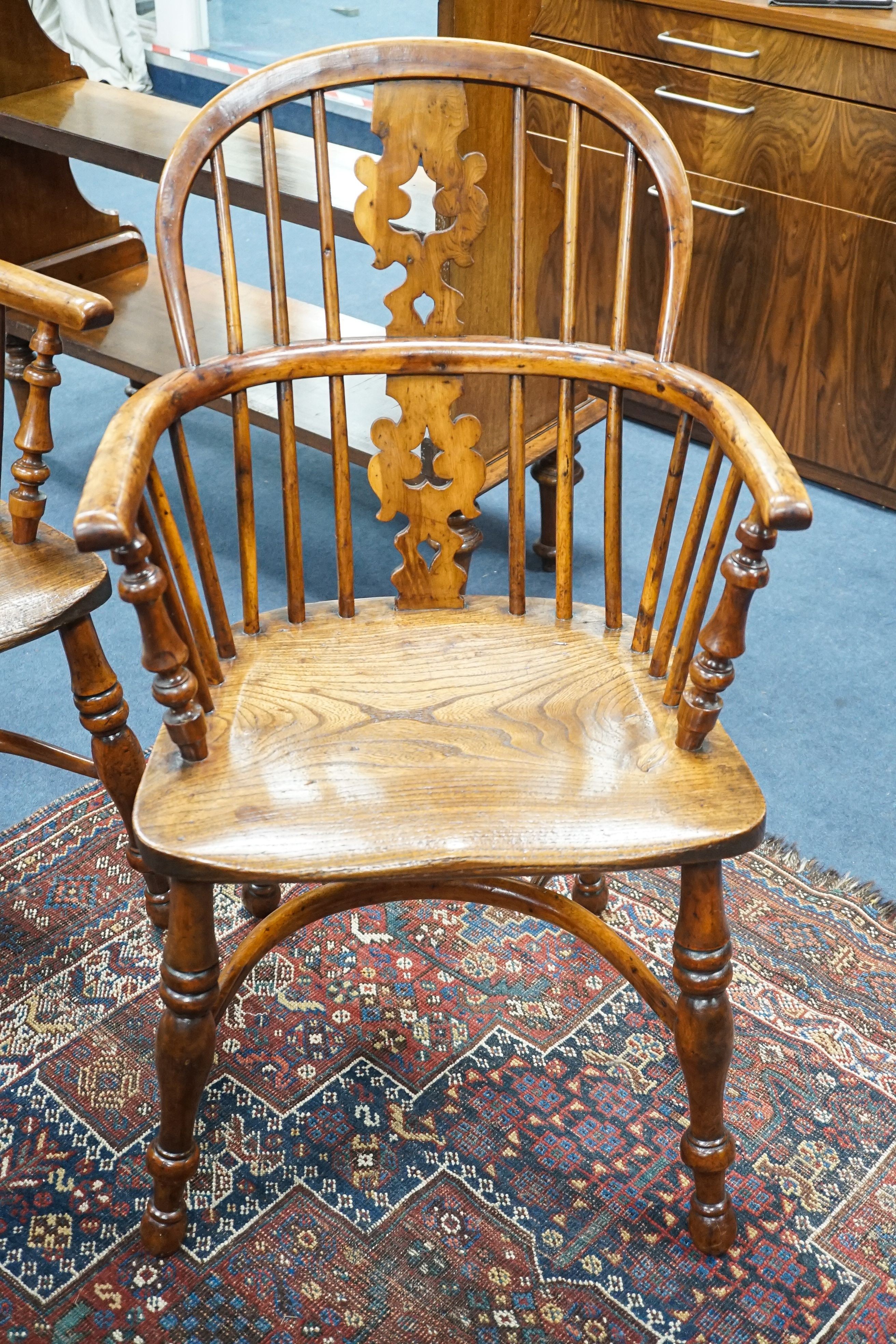 A pair of 19th century Yorkshire area yew and elm Windsor elbow chairs with crinoline stretchers, width 61cm, depth 40cm, height 95cm